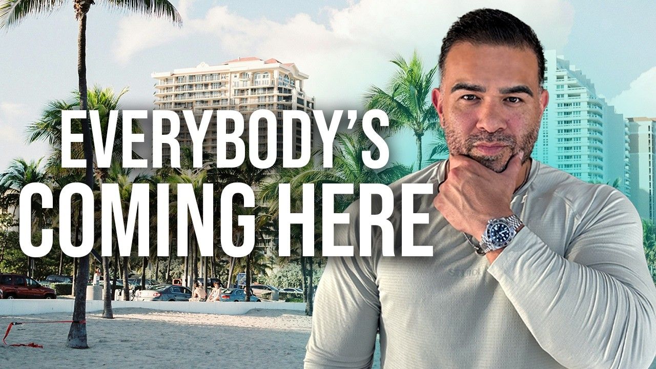 Text overlay “EVERYBODY’S COMING HERE” on a man standing on a tropical beach.
