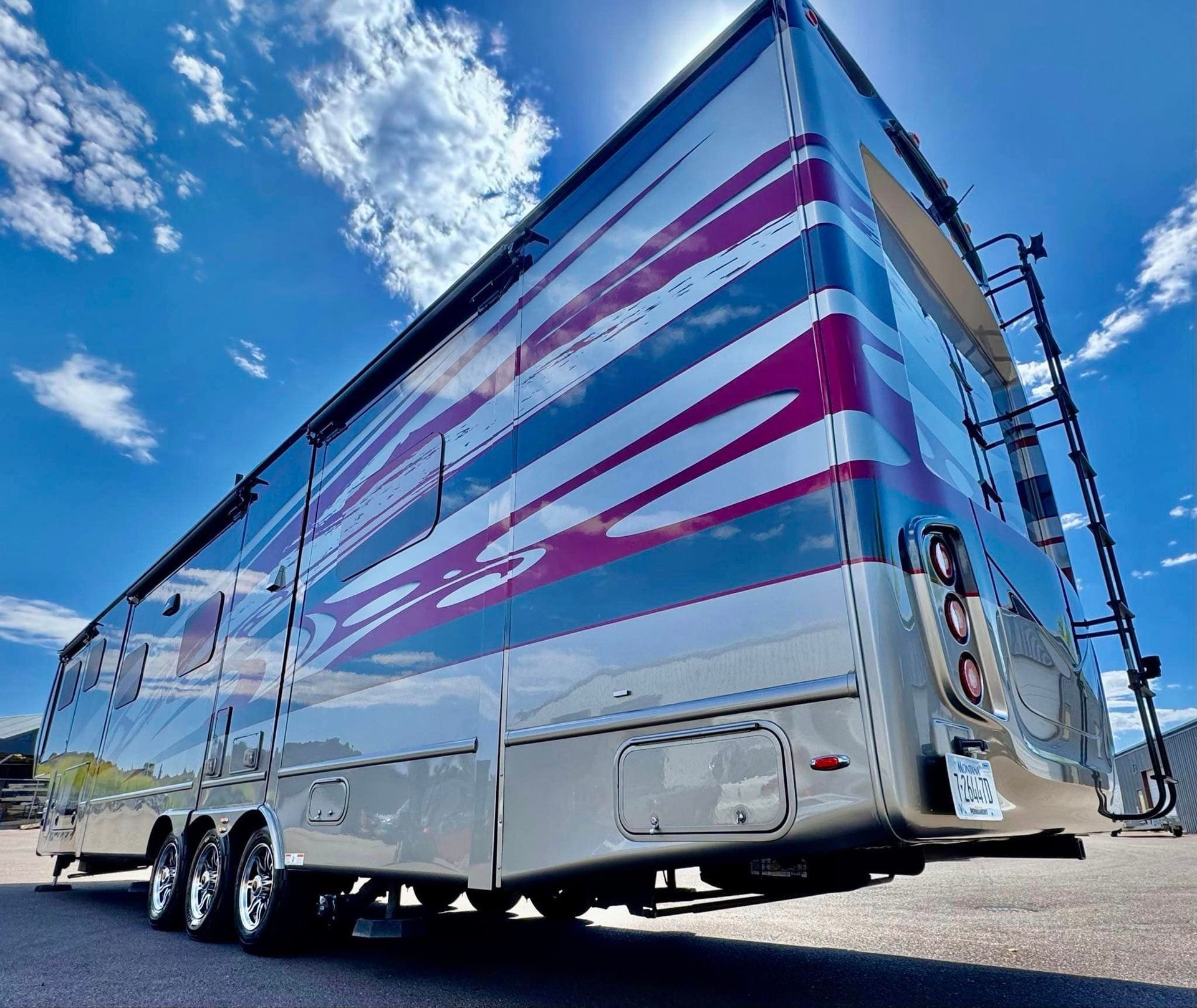 A large rv is parked on the side of the road with Bob Moses ceramic coating, Sensha World Crystal Glow
