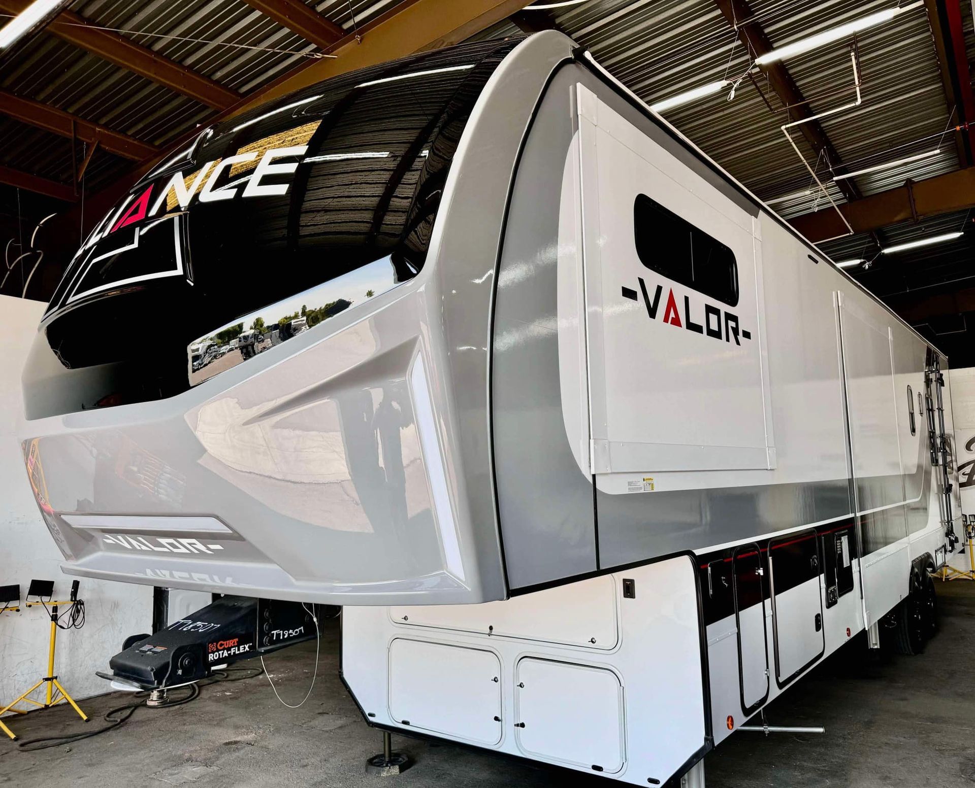 A white rv with the word valor on the side