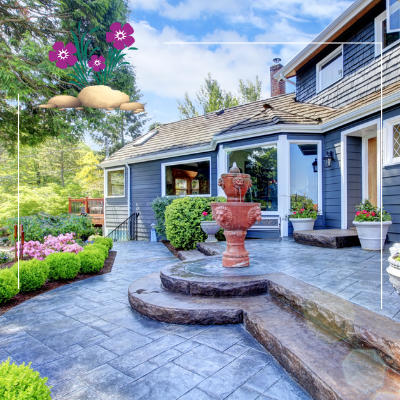a large house with a fountain in front of it .
