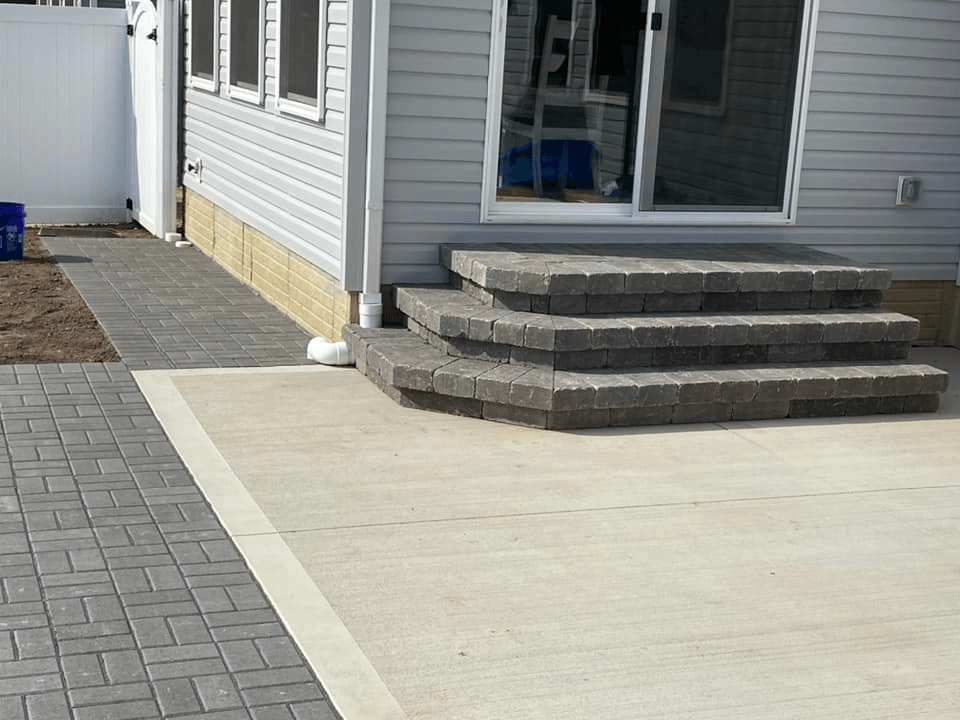 a white house with steps leading up to it