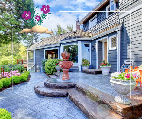 a house with a fountain and flowers in front of it .