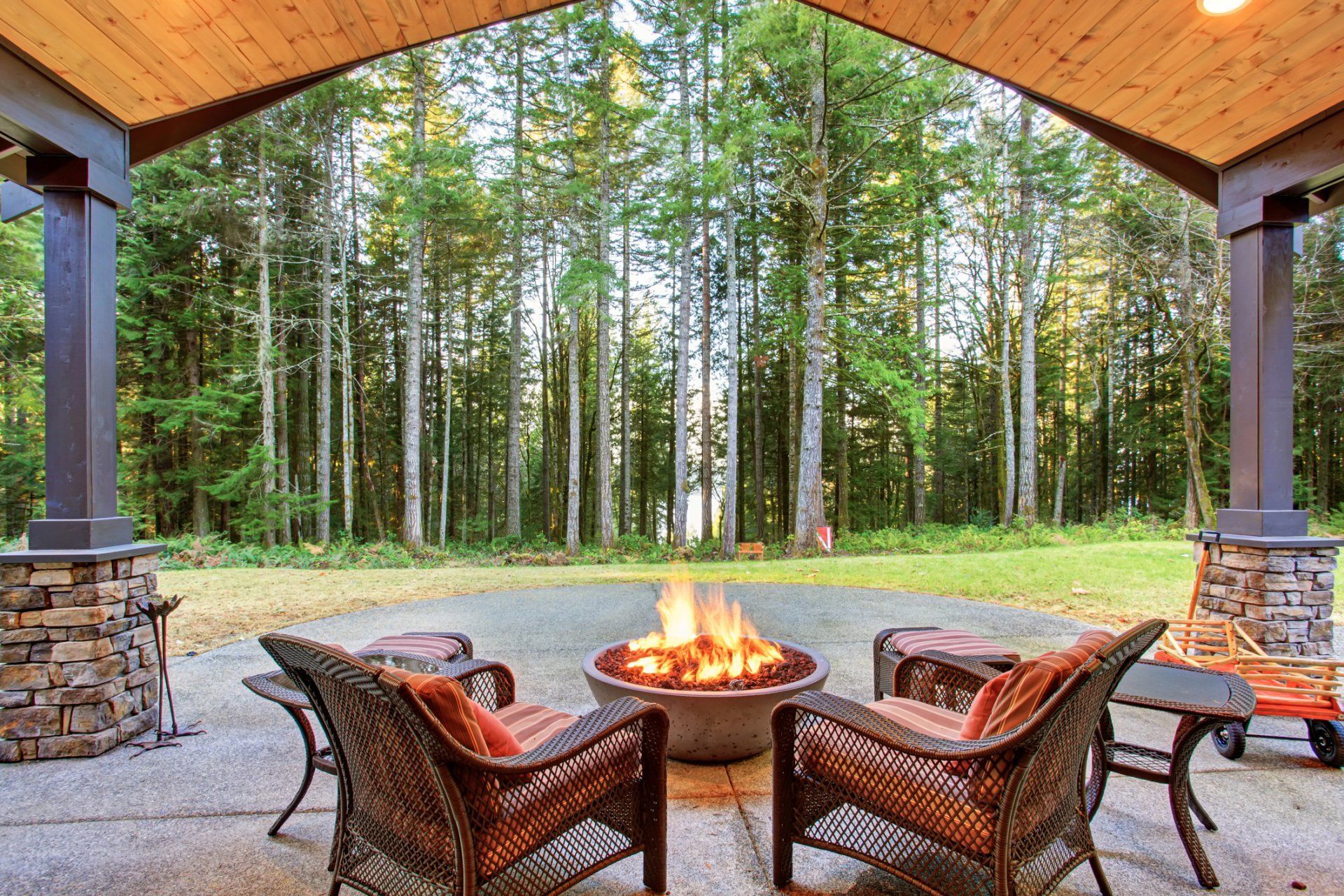 There is a fire pit in the middle of the patio.