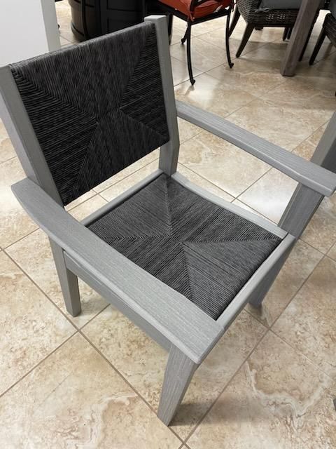 A chair is sitting on a tiled floor in a room.