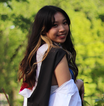 A close up of a woman taking a selfie and smiling.