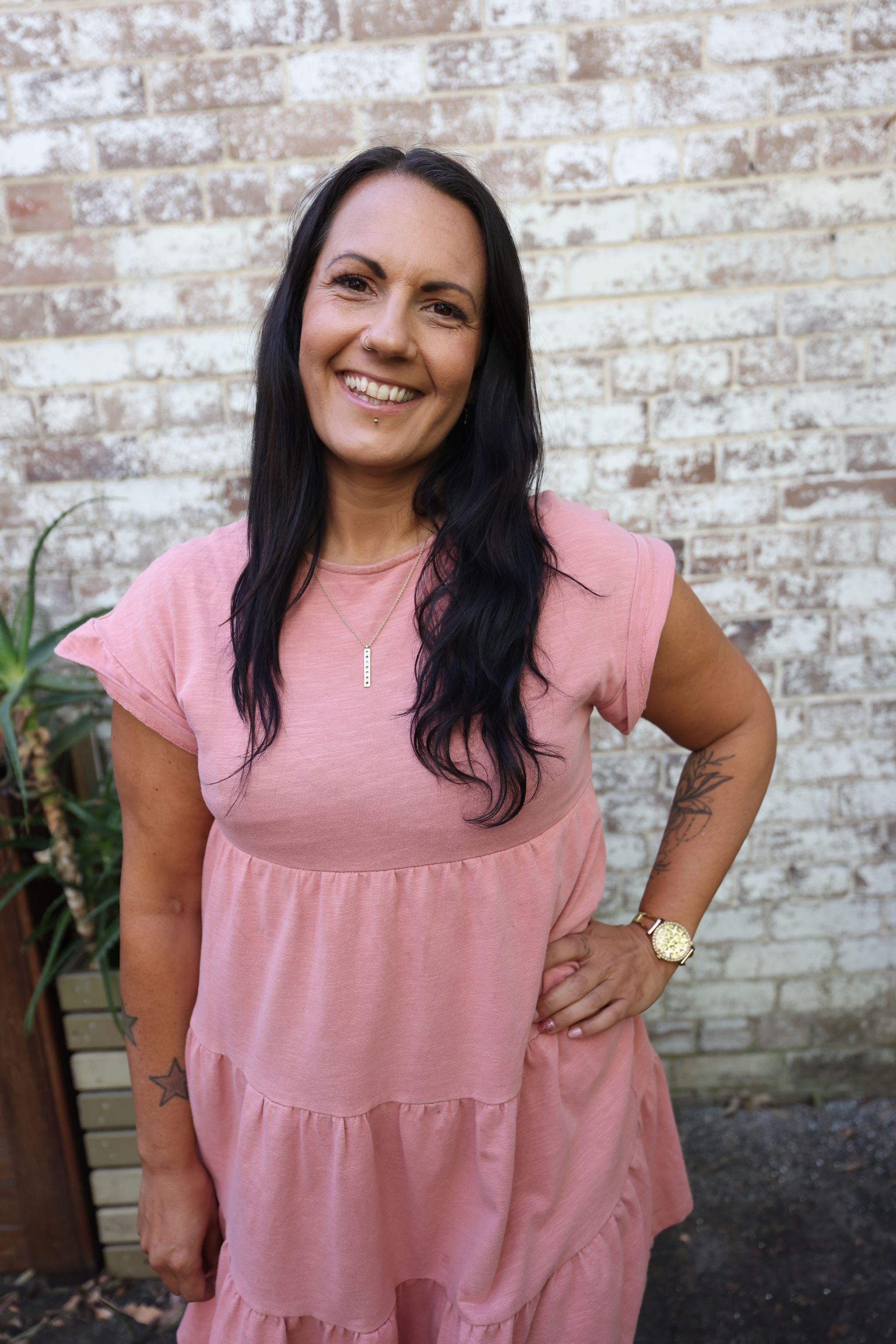 A Woman Is Kneeling Over A Man Laying On The Floor —Mind Breath Soul In Byron Bay, NSW