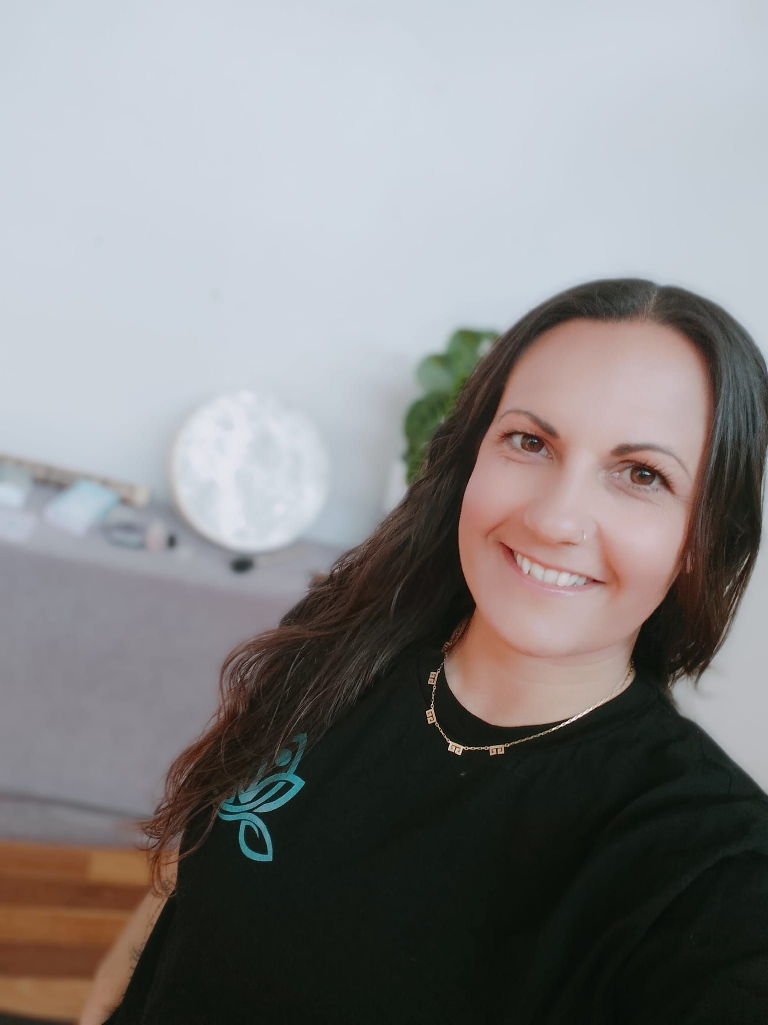 A Woman Is Sitting In A Lotus Position With Her Hands Folded In Front Of A Gong —Mind Breath Soul In Byron Bay, NSW