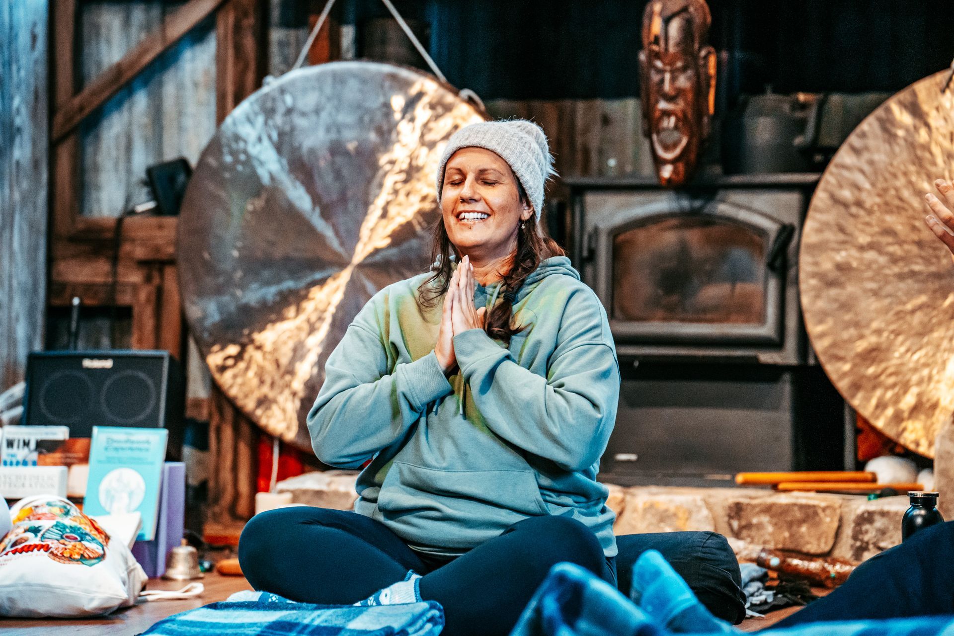 A Woman Is Standing In A Field With Her Eyes Closed And Her Mouth Open —Mind Breath Soul In Byron Bay, NSW