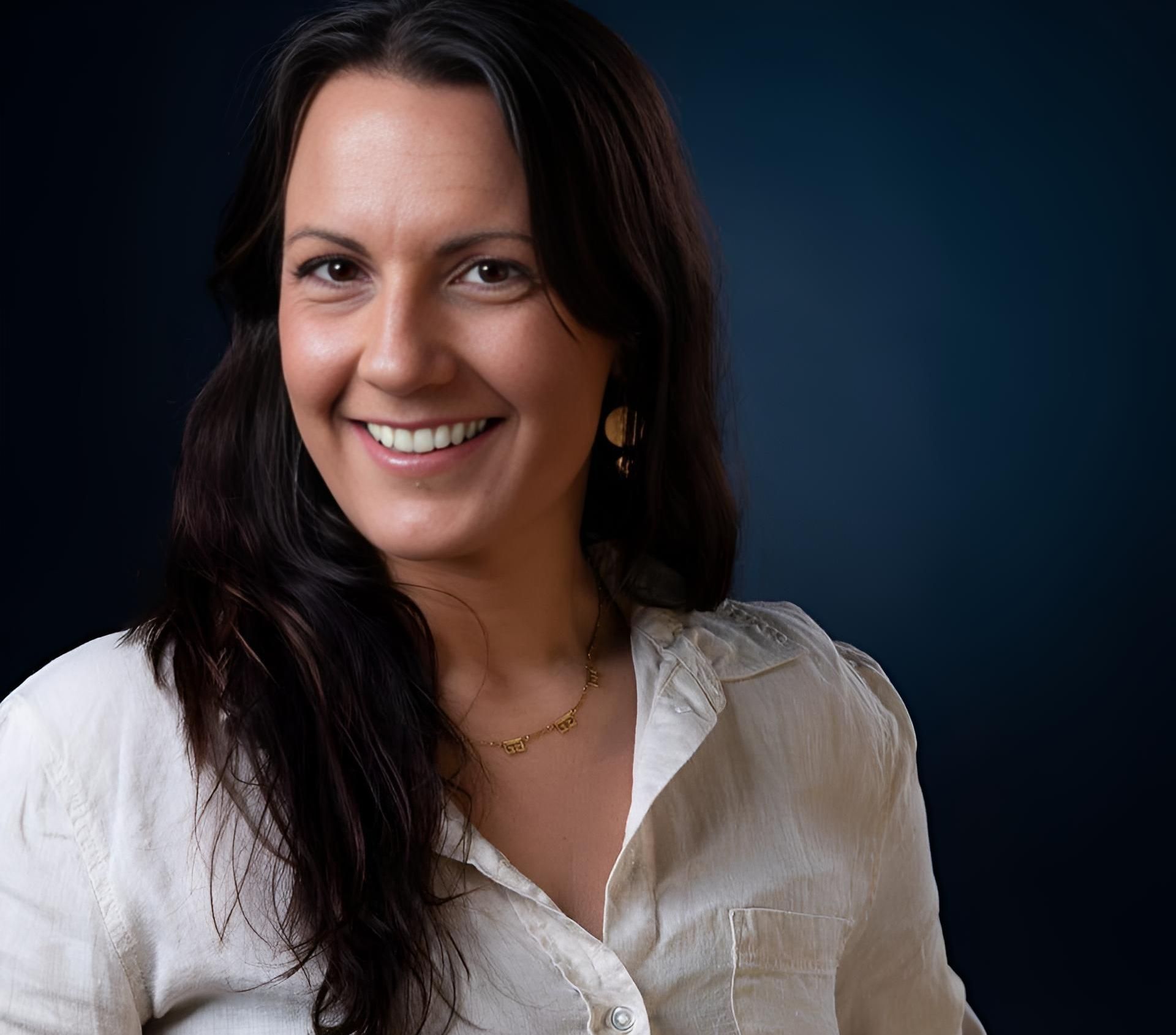 A Woman Wearing a White Shirt and Earrings Smiles for The Camera —Mind Breath Soul In Byron Bay, NSW