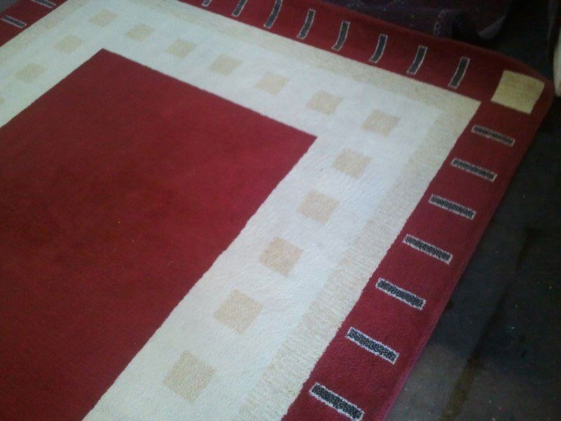 A Red And White Rug With Squares On It — Alice Springs Carpet Cleaning In Alice Springs, NT