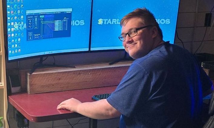 Editor Nicholas Friesen working at a computer suite.