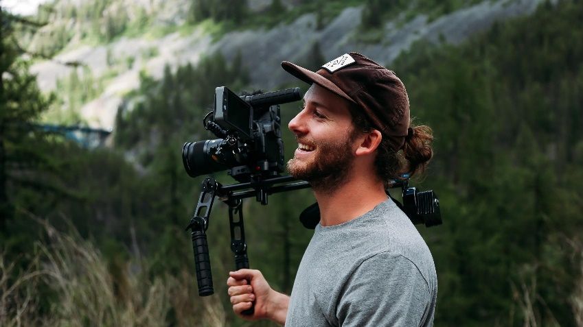 David Copithorne, Cinematographer holding a camera on his shoulder rig.