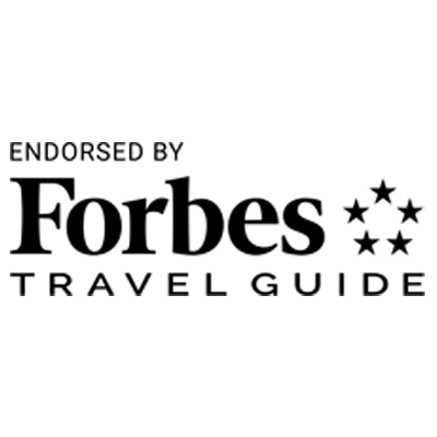 The forbes travel guide logo is black and white.