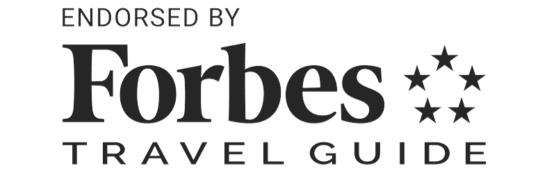 The forbes travel guide logo is endorsed by the forbes travel guide