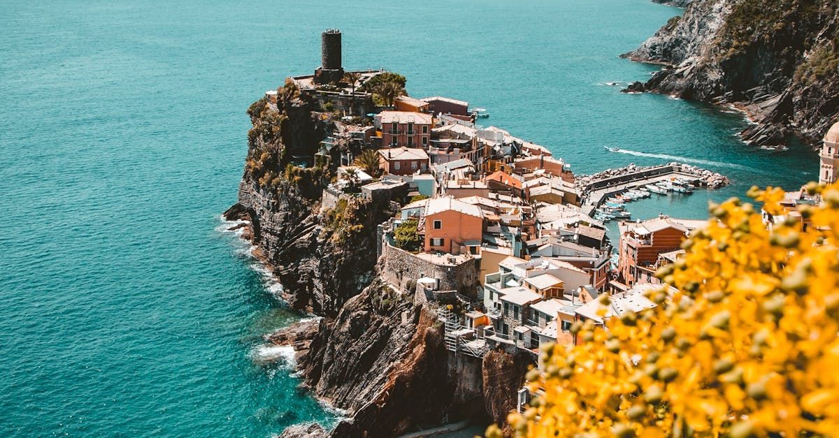 A small town on a cliff overlooking the ocean.