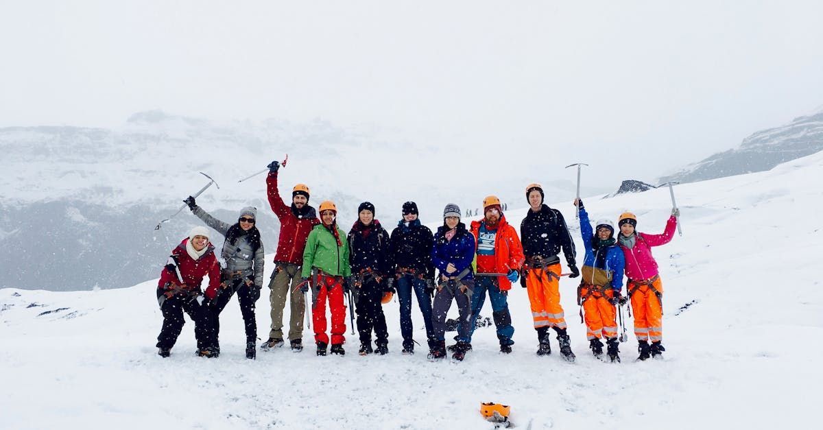 A group of people are posing for a picture in the snow.