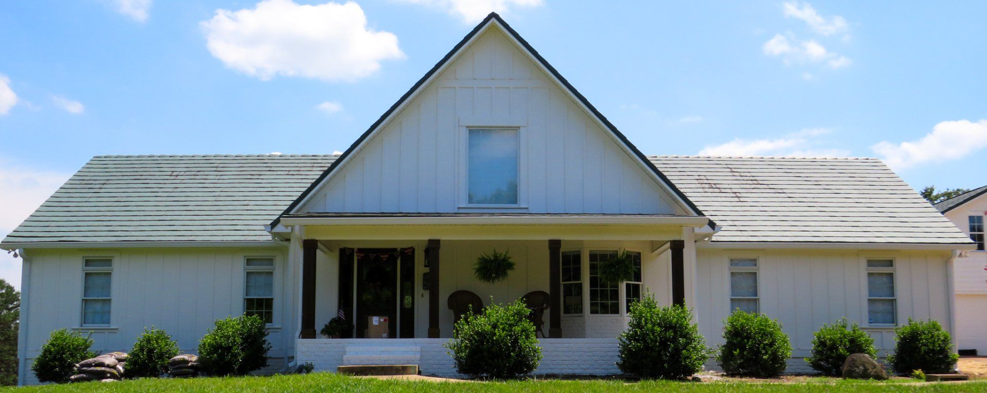 A white house with a blue sky in the background