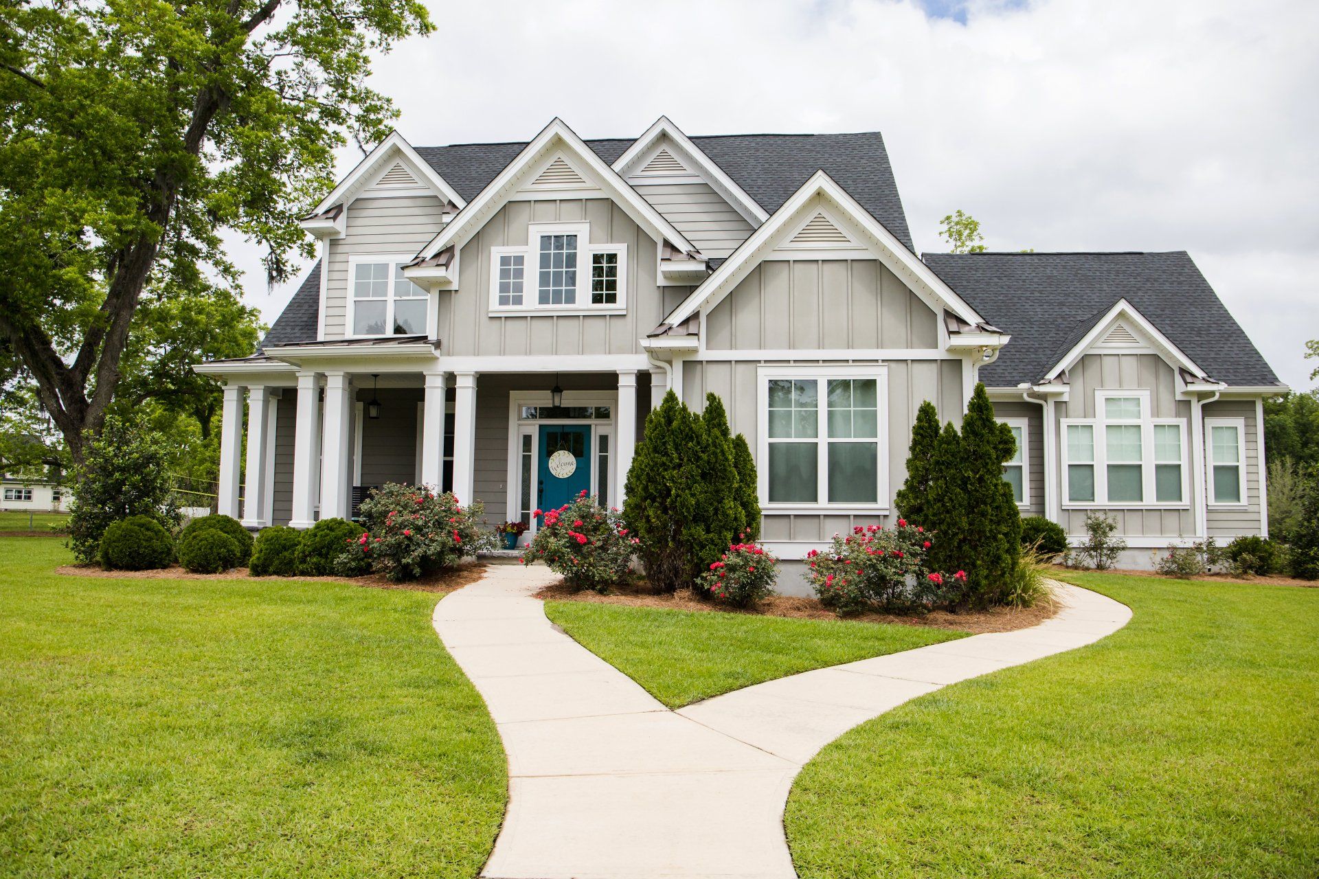 A large house with a walkway leading to it