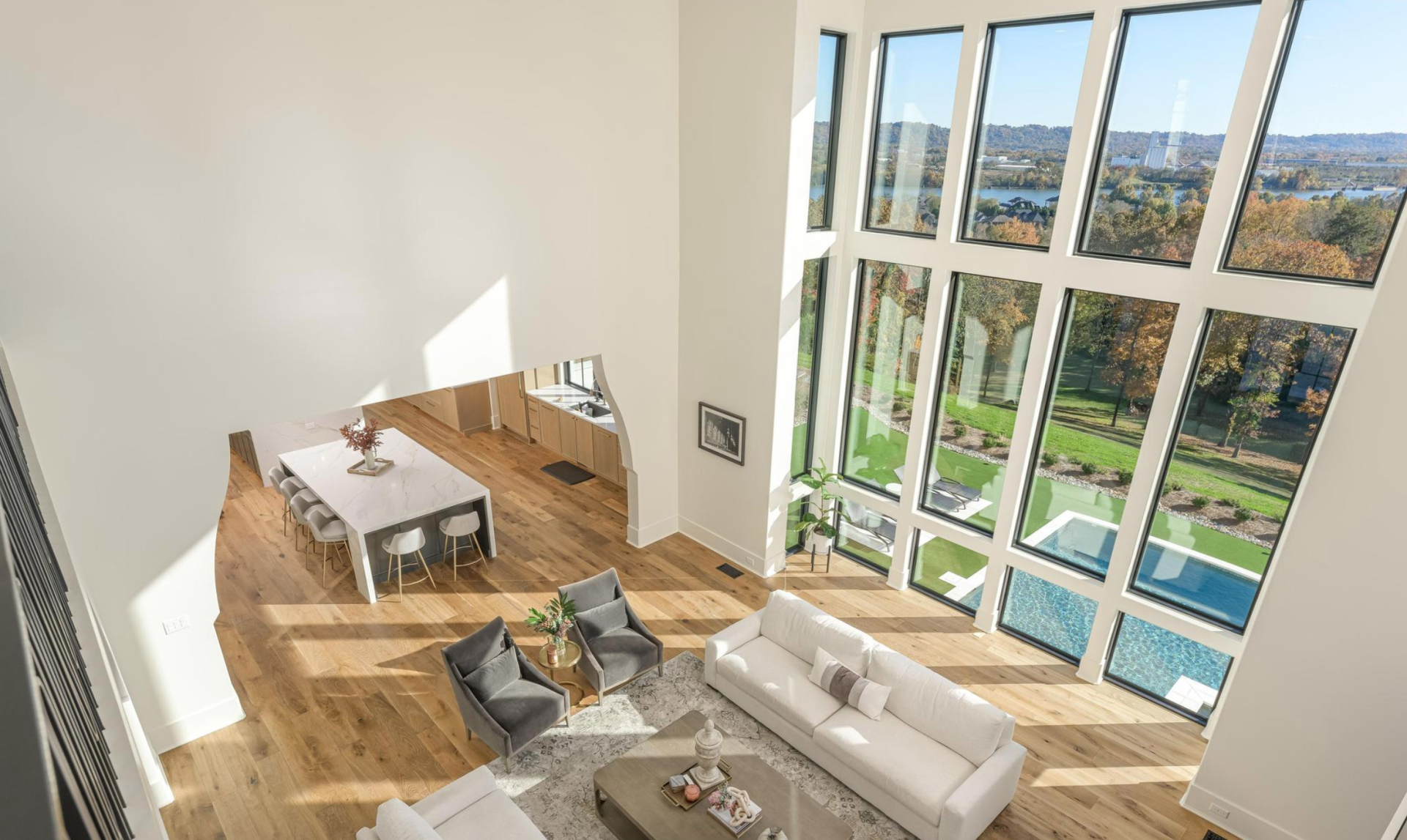 An aerial view of a living room with a lot of windows.