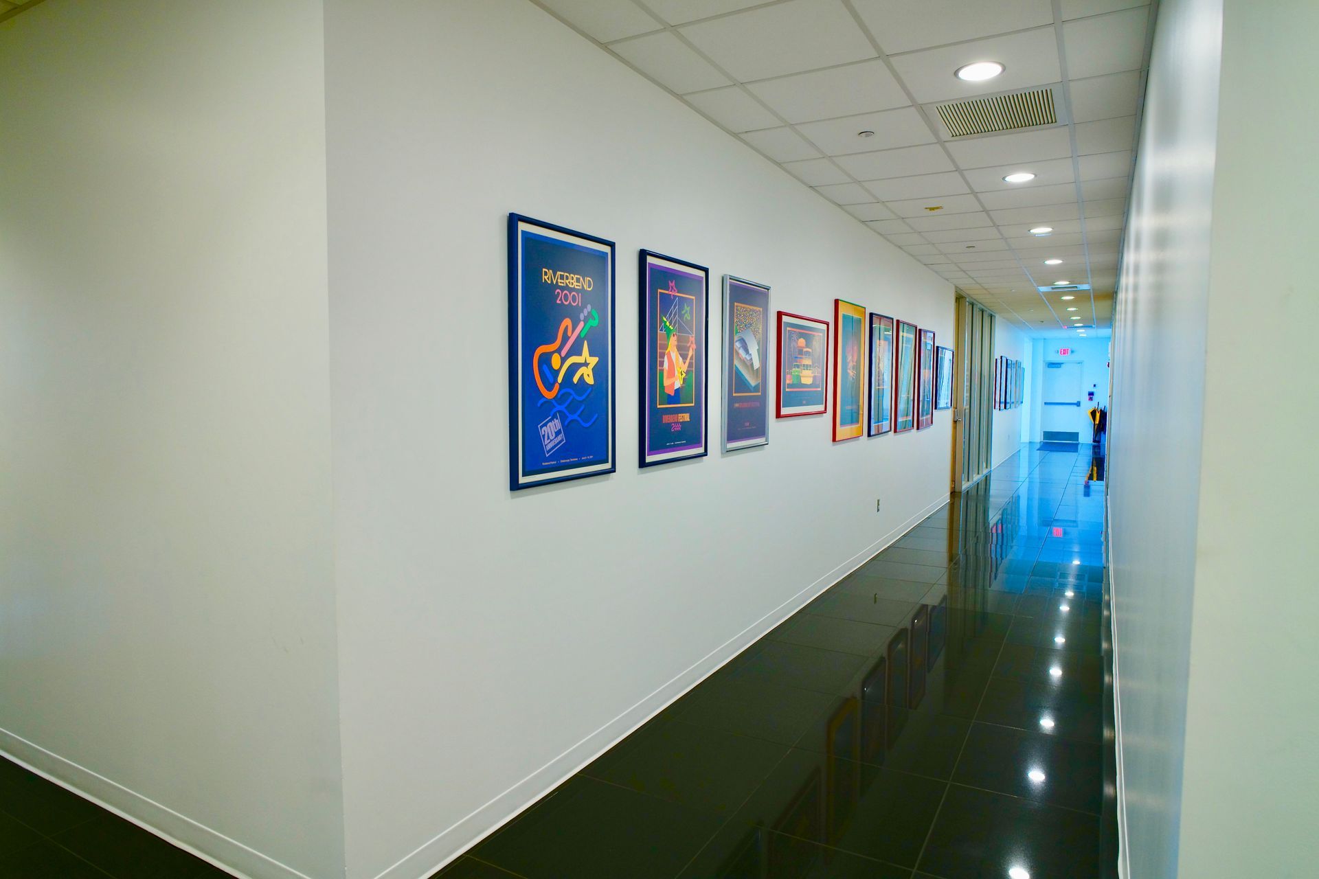 A hallway with a lot of pictures on the wall