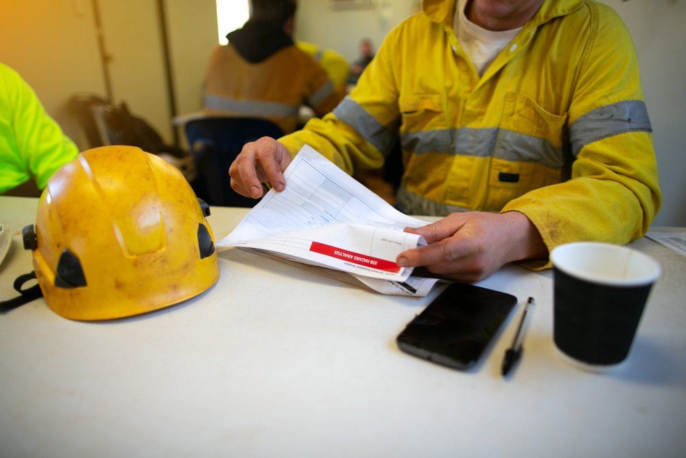 Employee Reviewing Job Hazard Analysis — Enterprise OHS in Aberdare, NSW