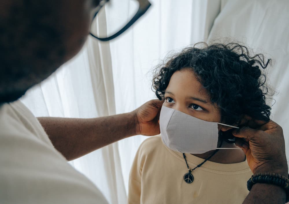 Man Fitting the Mask on Kid — Enterprise OHS in Aberdare, NSW