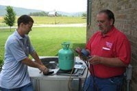 Two Workers Using Manometer — Manchester, TN — Shelton's Heating & Cooling