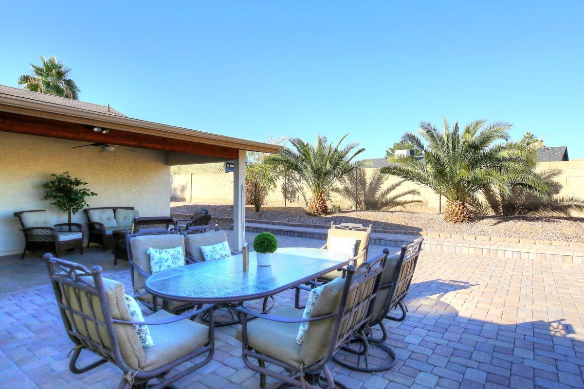 There is a table and chairs on the patio.
