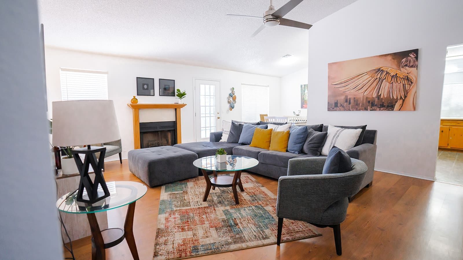 A living room filled with furniture and a fireplace.