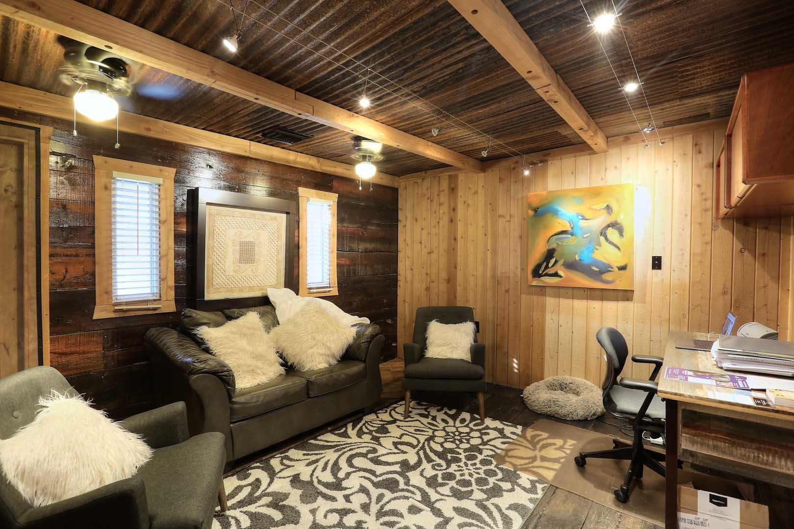 a counseling room with a couch , chairs , and a desk .