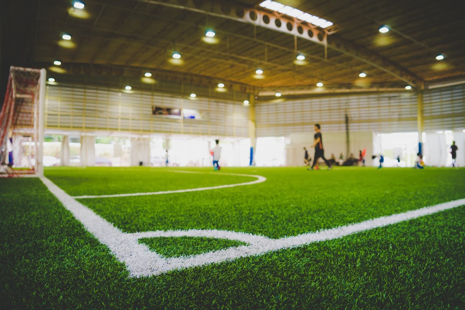 A Group of People Are Playing Soccer in An Indoor Stadium — Top Notch Turf in Cloncurry, QLD