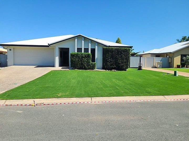 A House with A Lush Green Lawn in Front of It — Top Notch Turf in Rasmussen, QLD