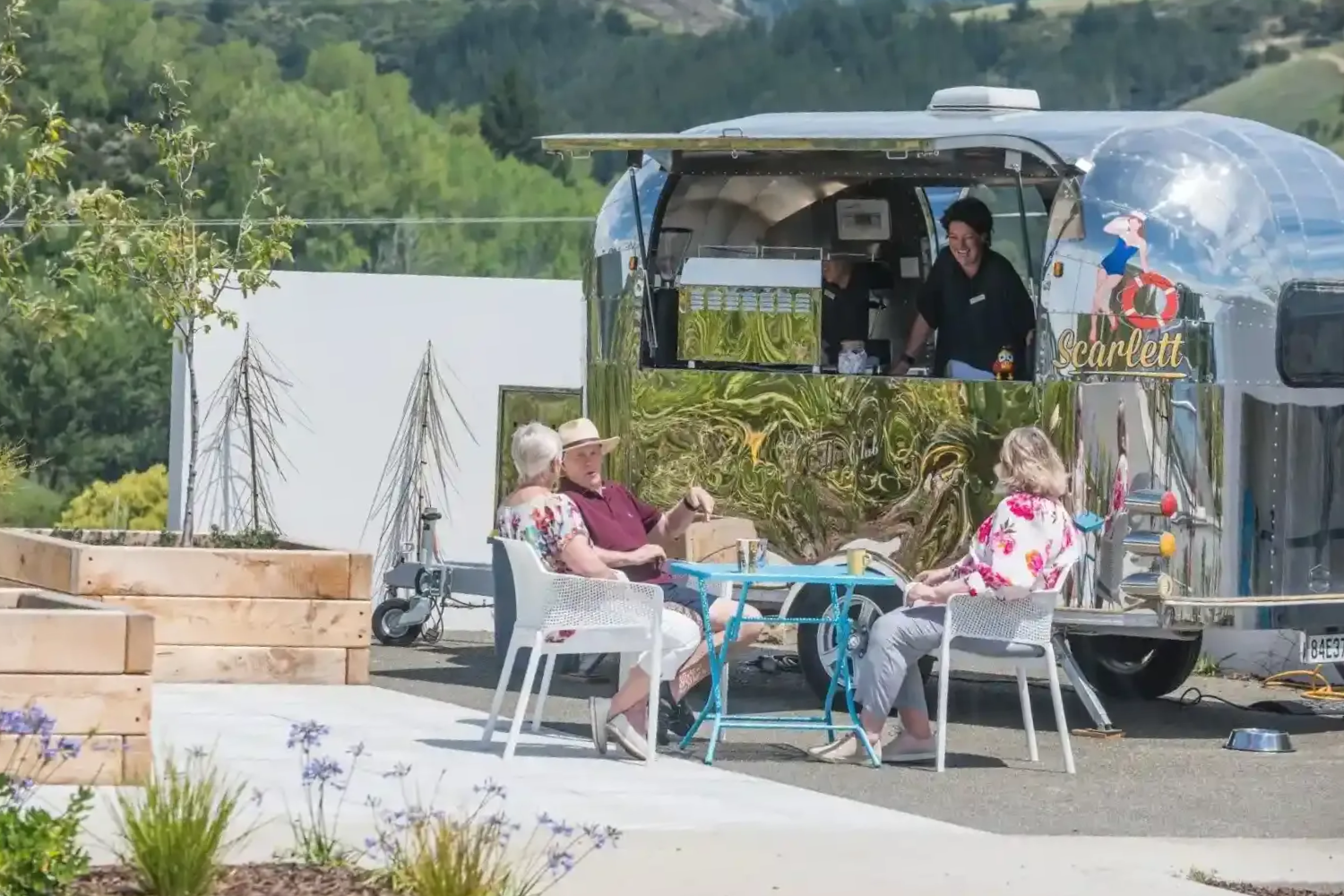 Residents enjoying coffee at outdoor café