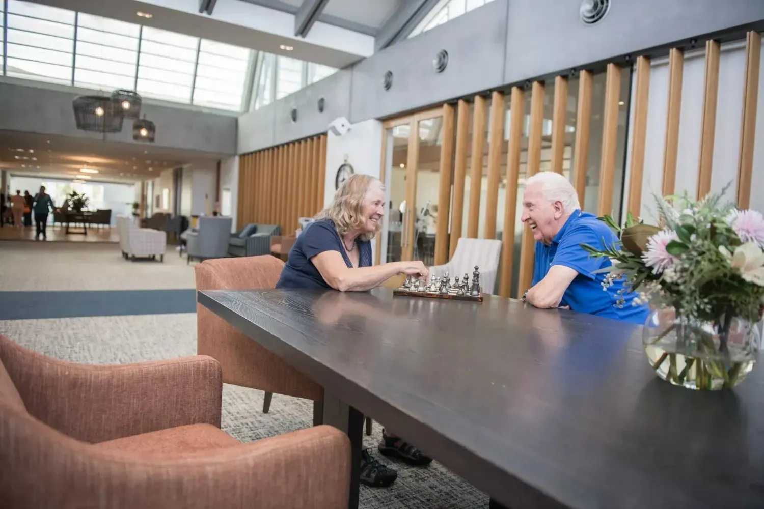 Residents playing chess at Coastal View lounge