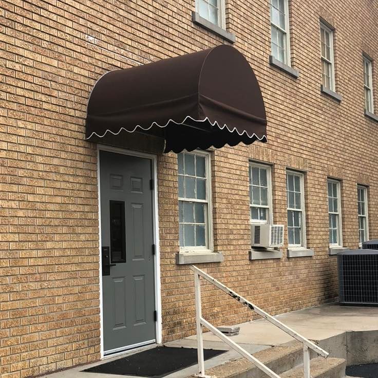 A brick building with a lot of windows is being built