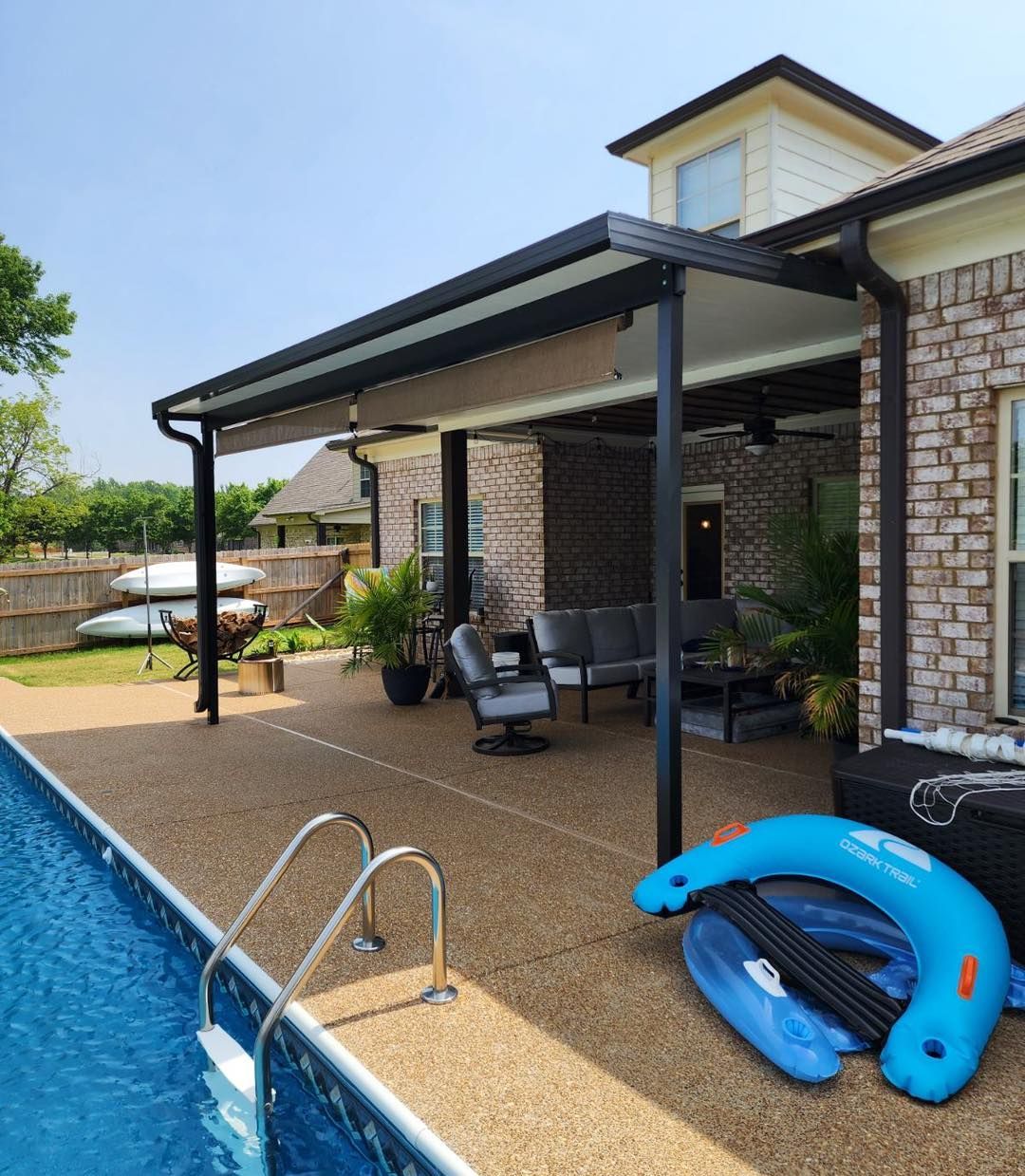 A house with a swimming pool and a covered patio