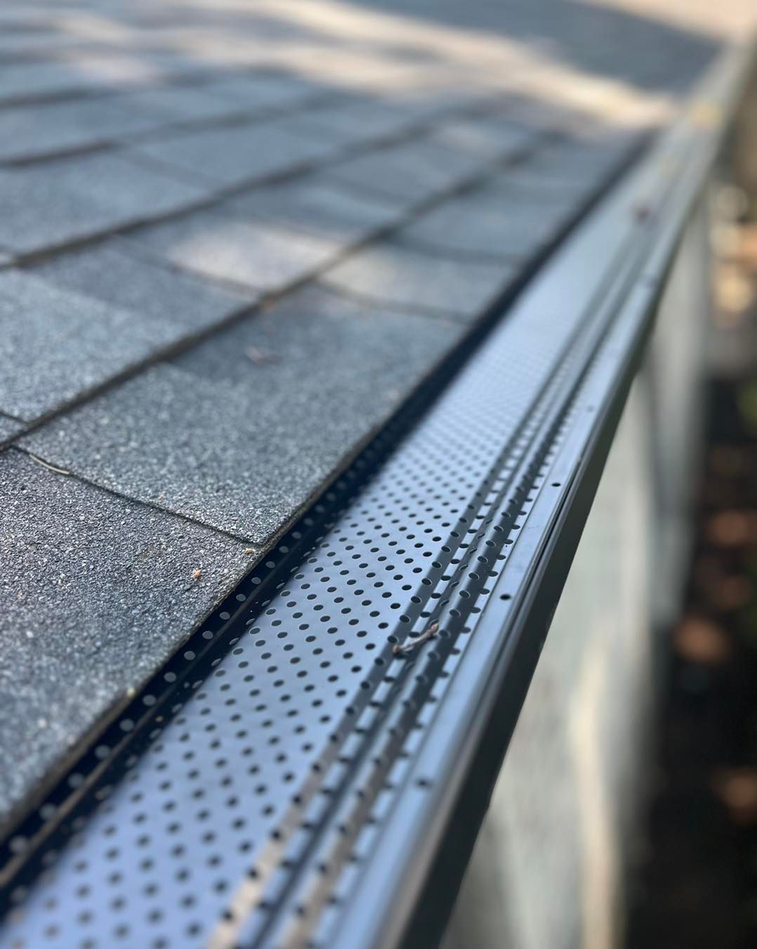 A close up of a gutter on a roof