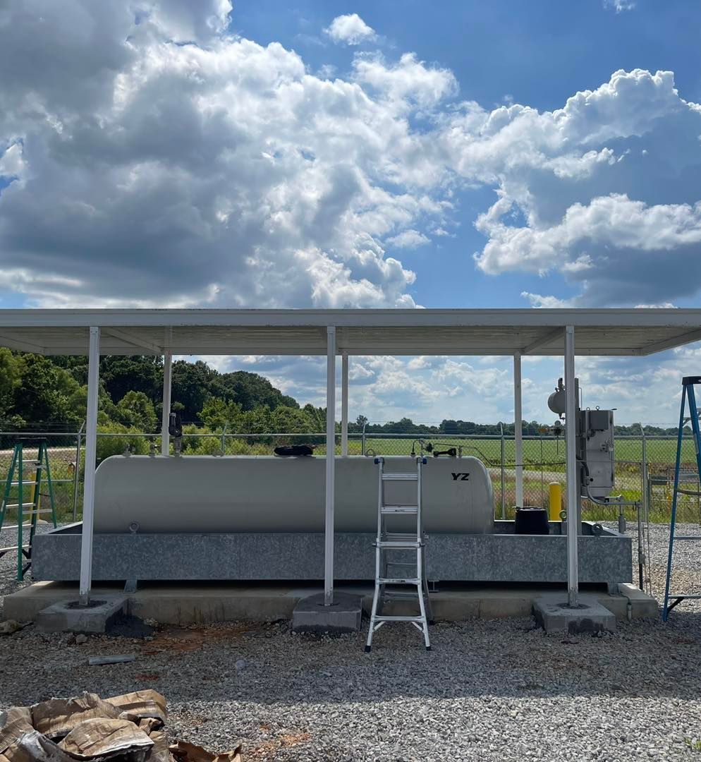A large white tank with a ladder underneath it