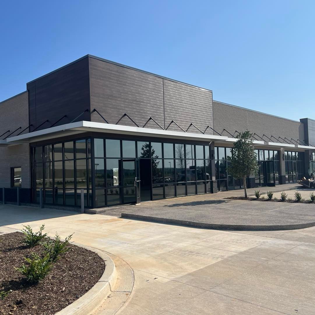 A large building with a lot of windows on a sunny day