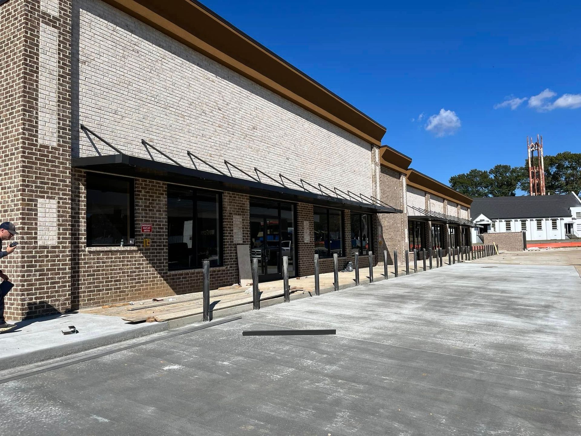 A brick building with a lot of windows is being built