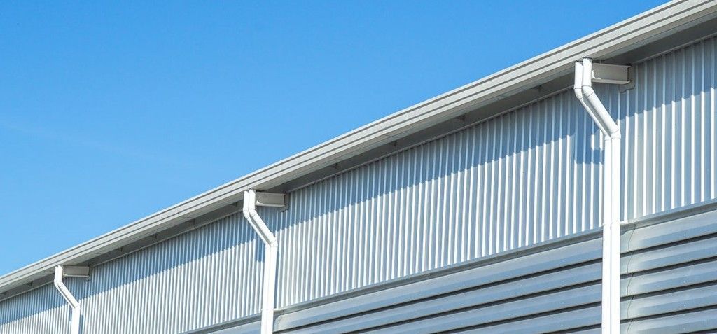 A house with a blue awning on the front of it.