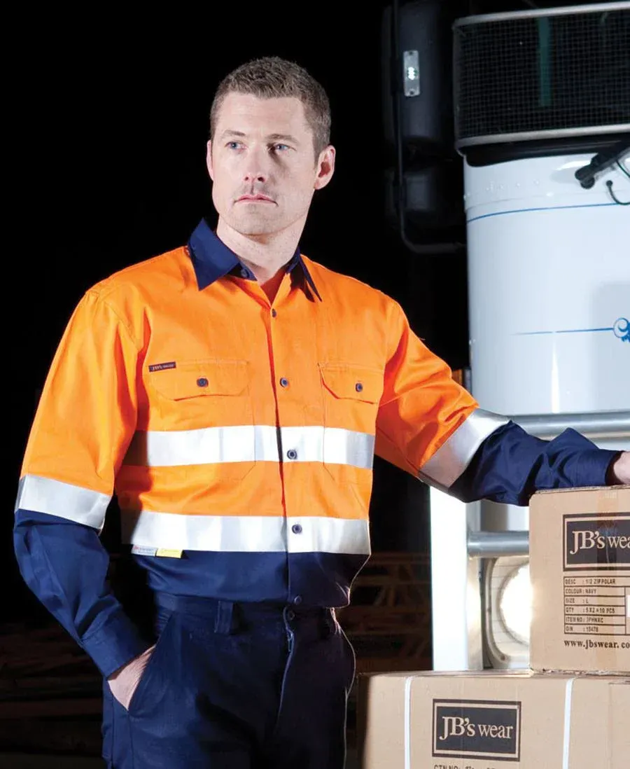 Man Wearing High-Visibility Shirt Stands Confidently — Hi-Vis Workwear in Townsville