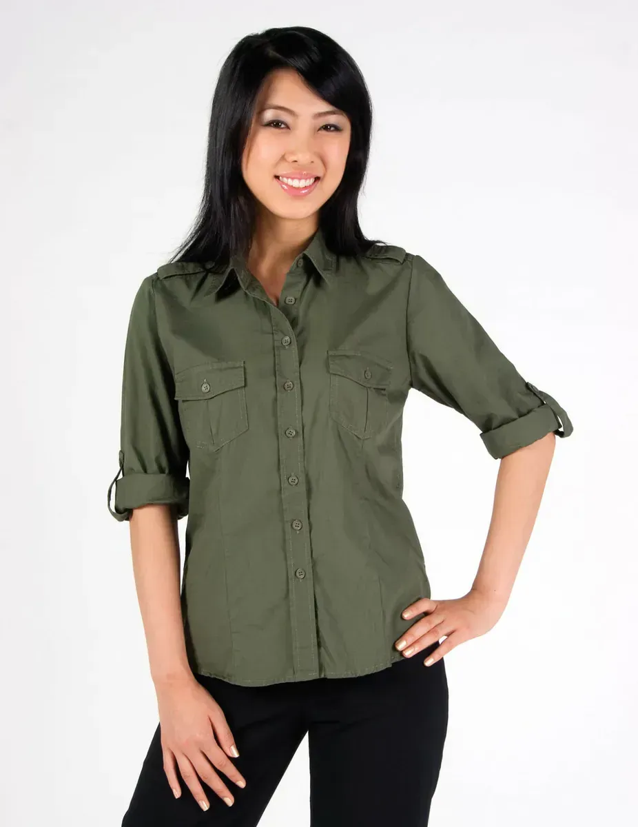 A Woman is Wearing a Green Shirt And Black Pants — Our Suppliers Catalogue