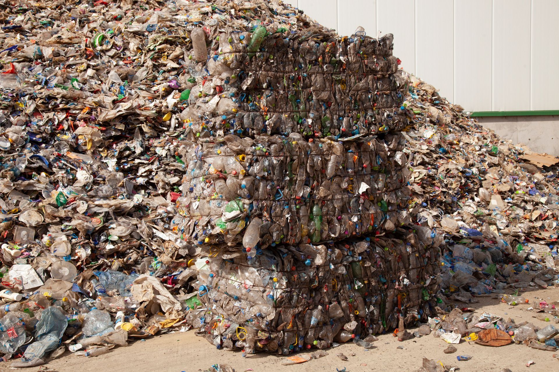 A pile of plastic bottles is stacked on top of each other. A pile of plastic bottles is stacked on top of each other.