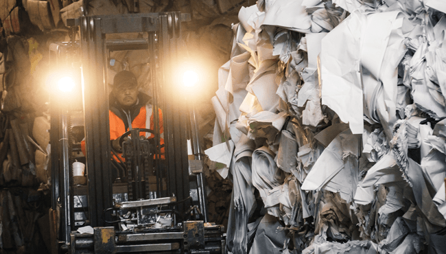 Man Driving Equipment On Recycling — Chicago, IL — Mid America Paper Recycling Co Inc