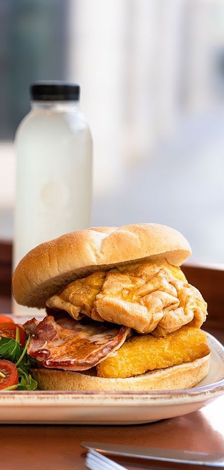 a cup of coffee on a saucer with a heart in the foam