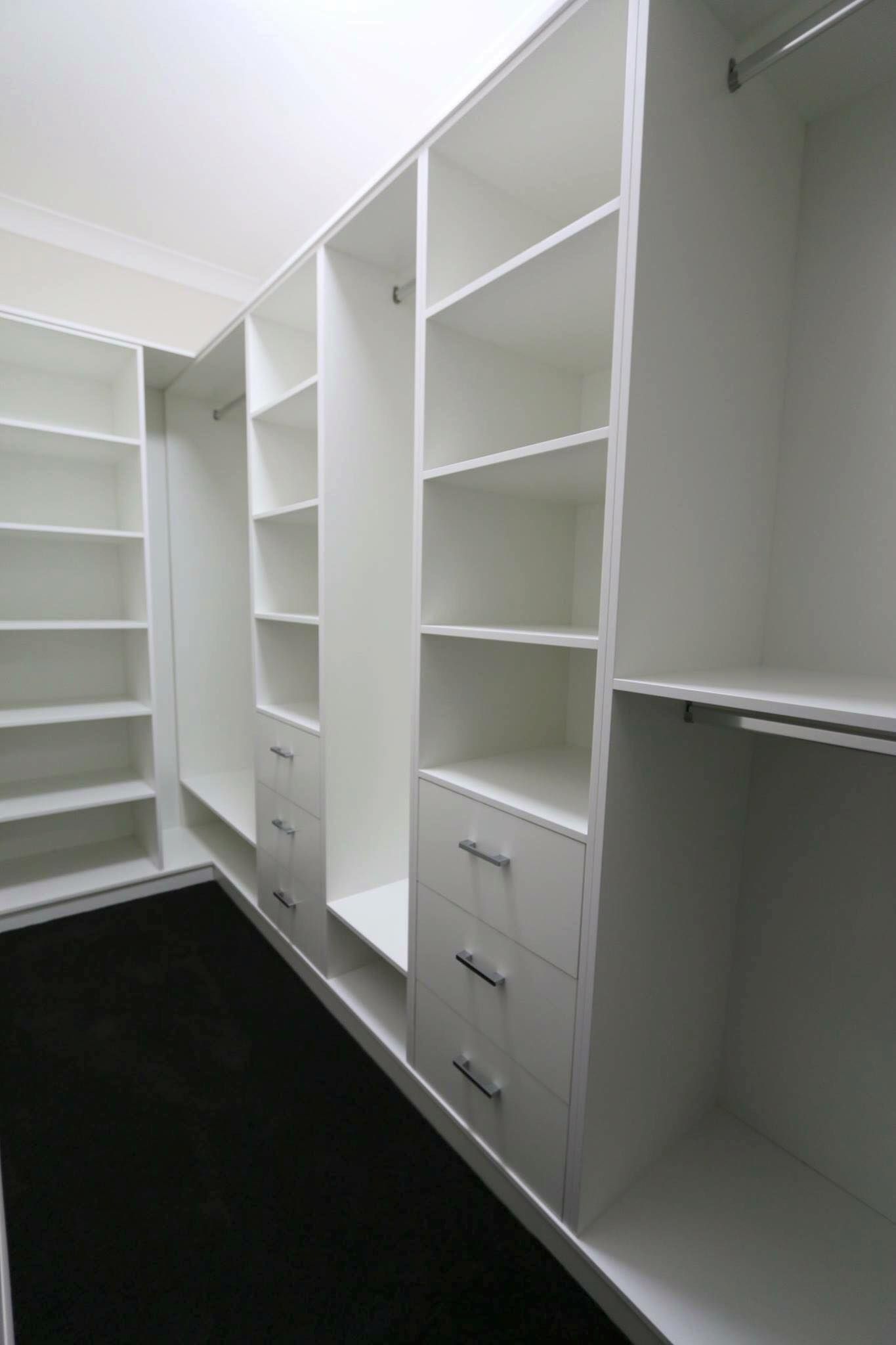 A Walk in Closet With Lots of Shelves and Drawers — Ross Joinery Kitchens In Garbutt, QLD