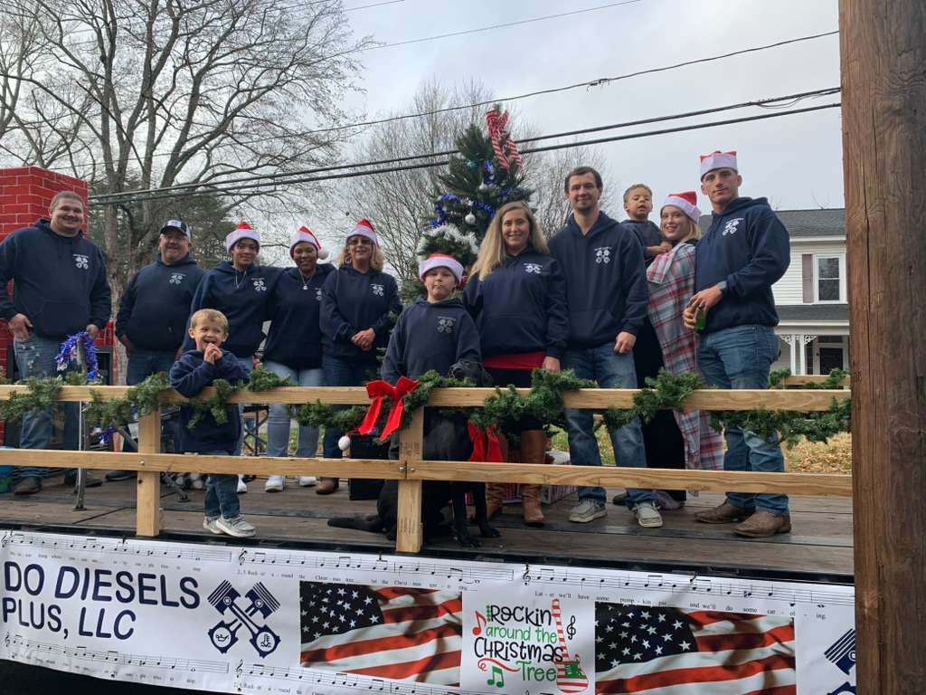 People on a Christmas parade float.