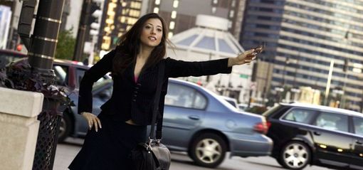 Woman seeking local transportation from a taxi cab company in Monroe, NY