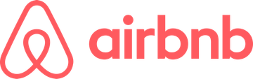 Airbnb logo in coral pink on a white background
